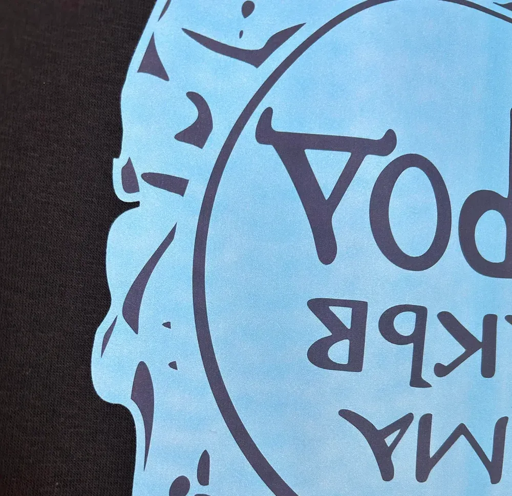 The white ink didn't completely cover, so the underlying colored ink is showing through